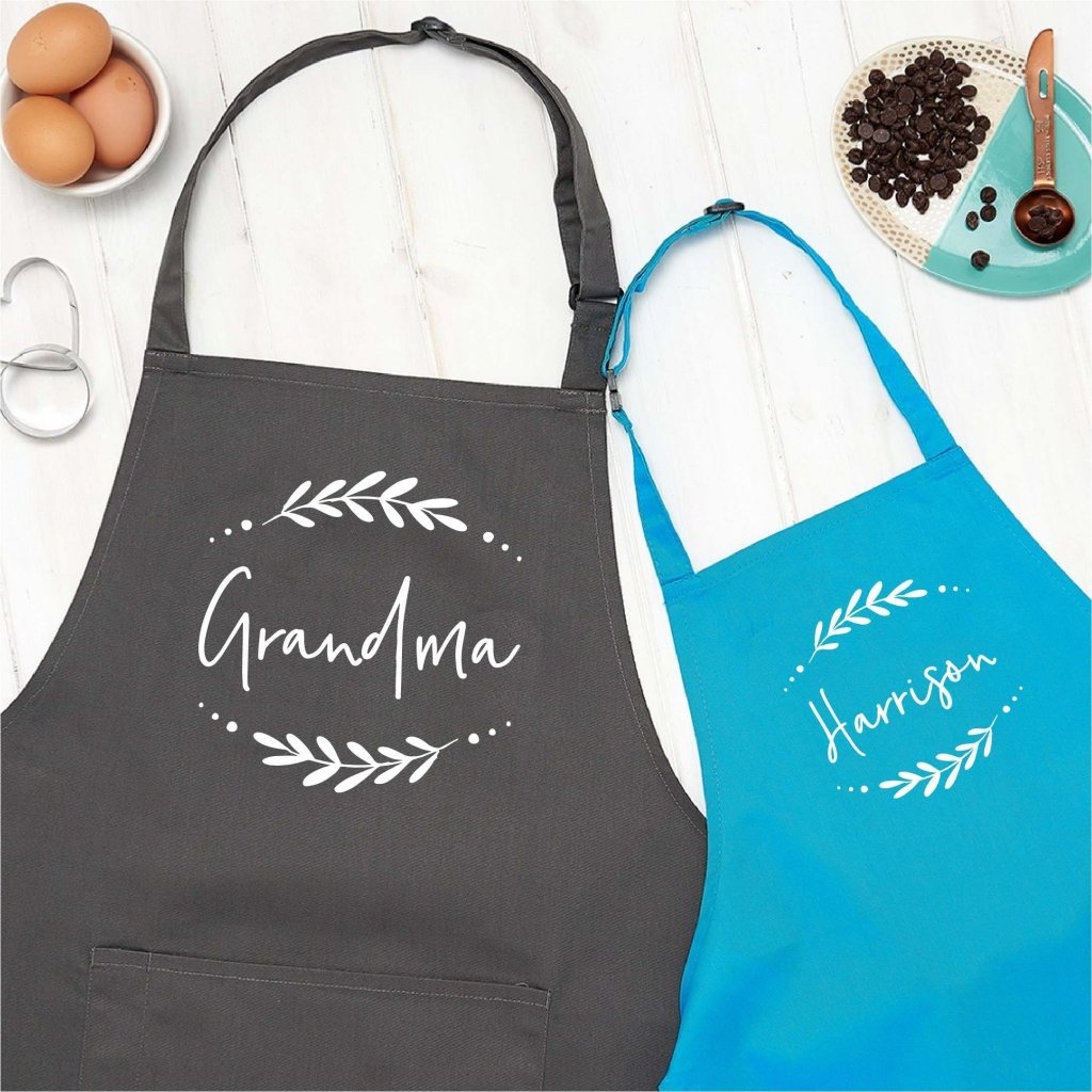 https://sundaysdaughter.com/cdn/shop/products/personalised-grandma-and-child-kitchen-apron-set-826273.jpg?v=1625561048